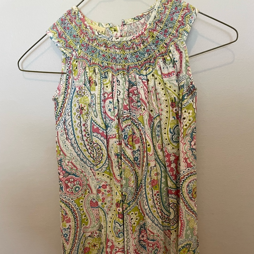 Floral sleeveless smocked dress. Size 6